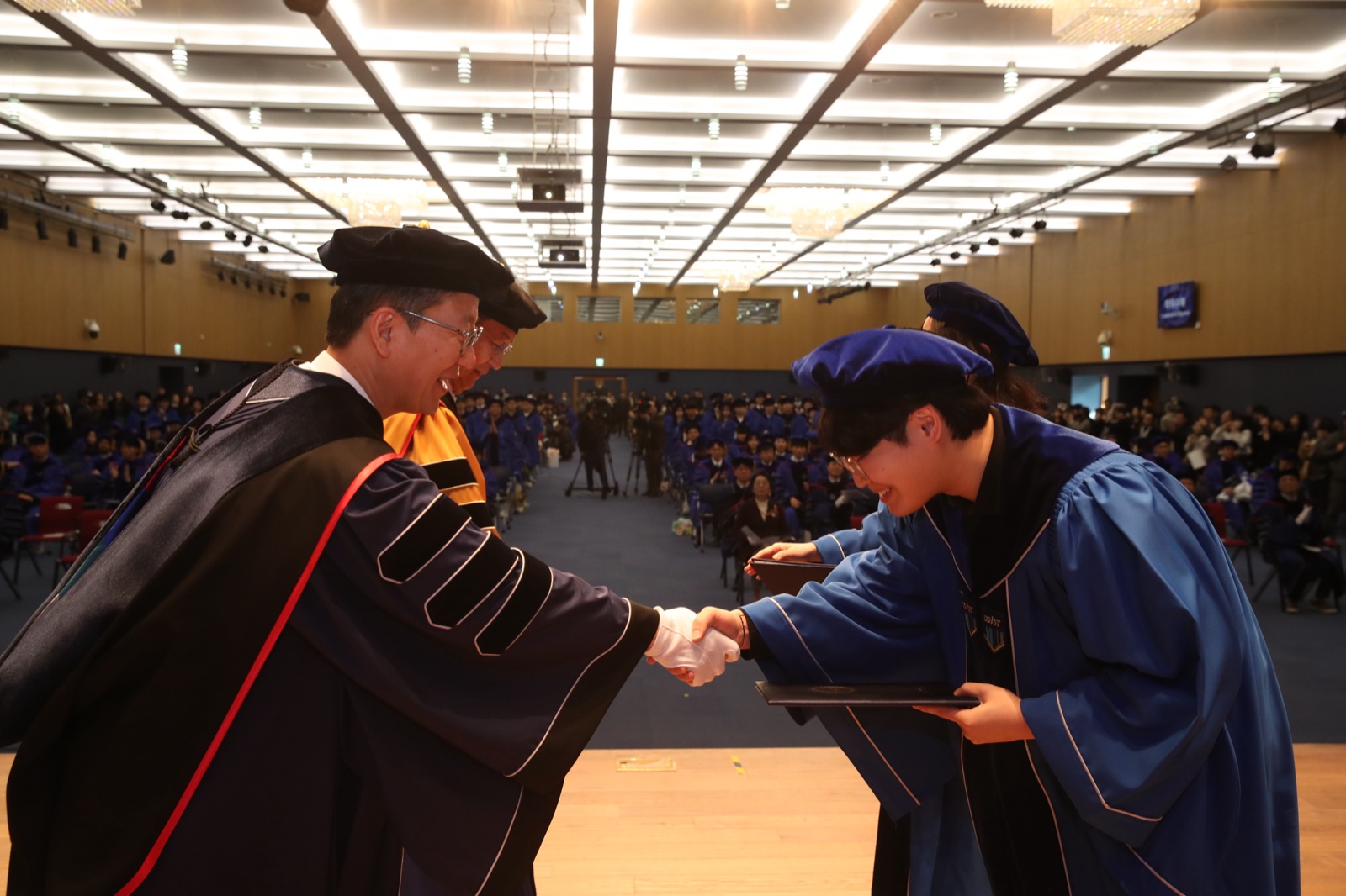 Receiving the diploma as a graduate representative at DGIST commencement